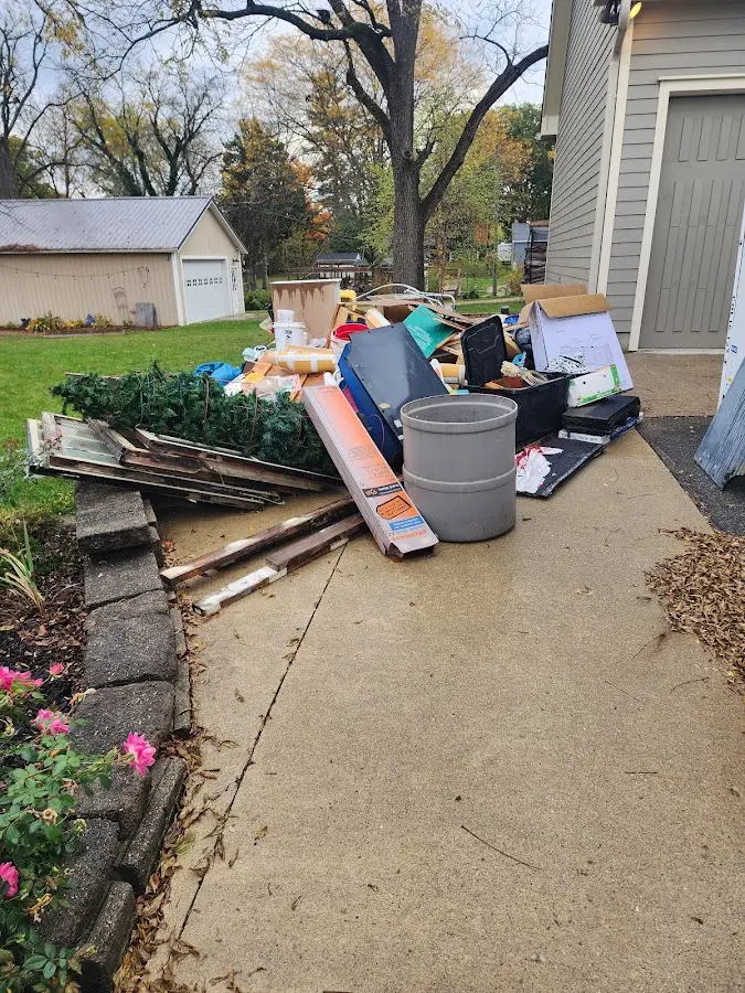 Dumpster being loaded with debris for Estate Cleanout Dumpster Rental in Colorado Springs